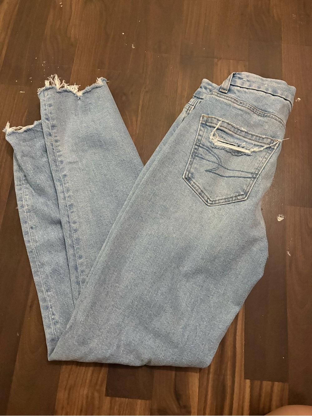 American Eagle Outfitters Light Wash Skinny Jeans with Distressed Hem